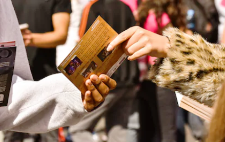 Event Ambush or Takeover Guerilla Marketing handing out flyers